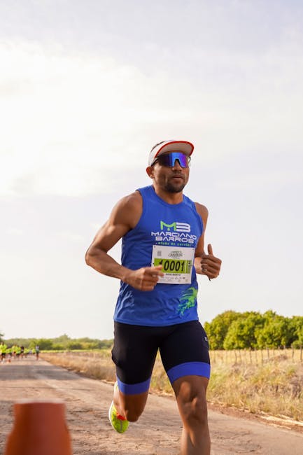 A person in a kayak navigating a calm river with greenery on the banks